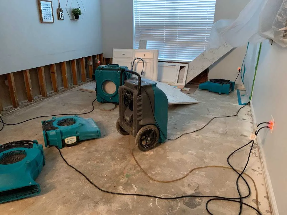 Dehumidifier in flood-cut room for Water Damage Restoration in Clyde